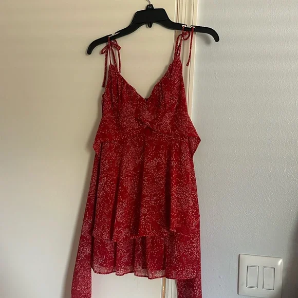 Francesca’s red mini flowy dress with bow in the